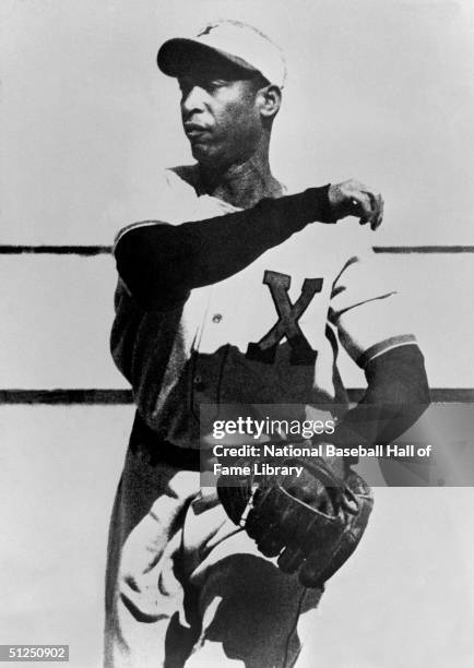 Martin Dihigo throws the ball before a season game. Martin Dihigo played for the Negro Leagues New York Cubans from 1923-1945.