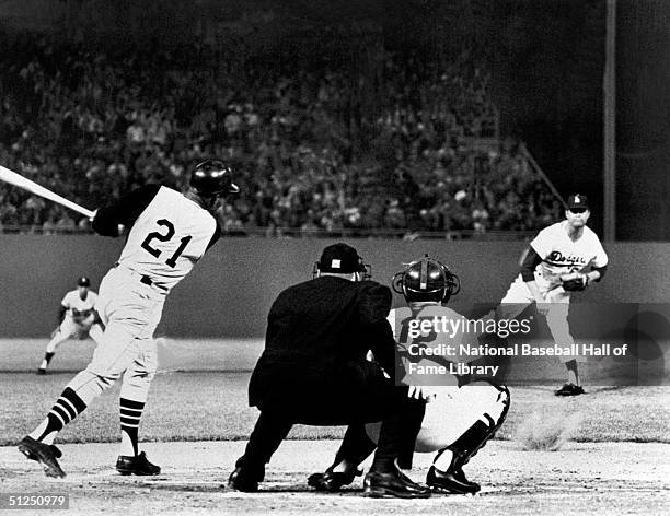 Don Drysdale of the Los Angeles Dodgers pitches to Roberto Clemente of the Pittsburgh Pirates during a season game at Dodger Stadium in Los Angeles,...