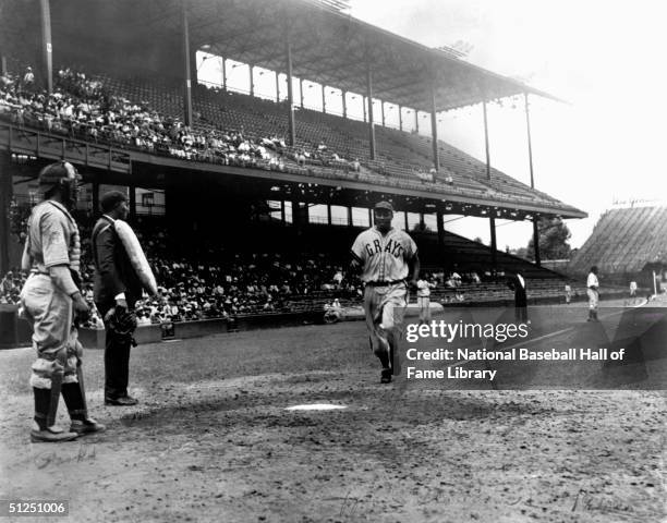 Josh Gibson jogs to home base during a season game. Josh Gibson played for the Homestead Grays of the Negro Natonal League from 1929-1931 then...