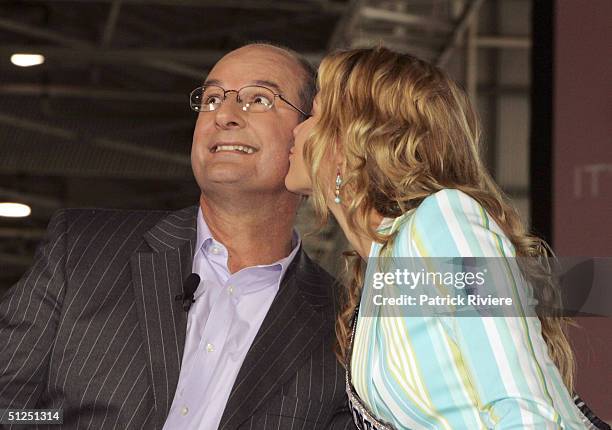 Host David Koch kissed by Miss Universe Jennifer Hawkins during a live show for the homecoming of the Australian Olympic team at the Qantas jetbase...