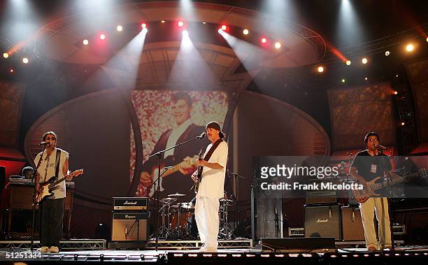 Musician Carlos Santana rehearses his performance with Los Lonely Boys for the "5th Annual Latin Grammy Awards" August 31, 2004 at the Shrine...