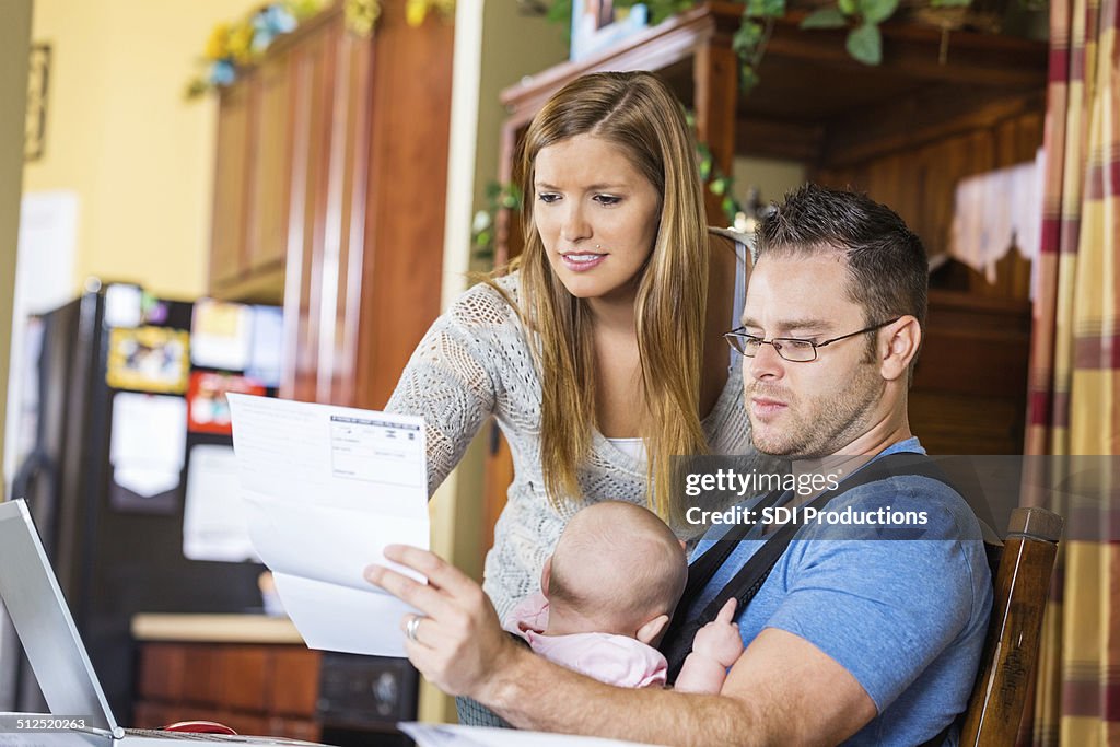 Parents paying bill form hospital while caring for daughter