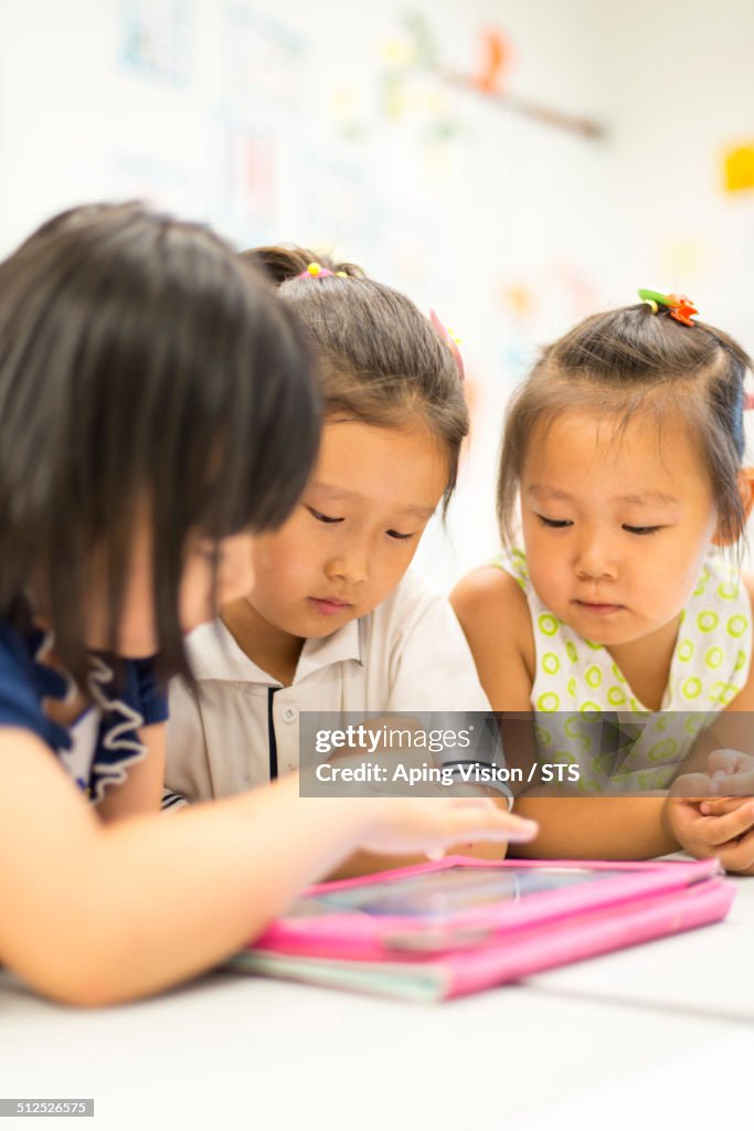 Pupil in class with digital tablet