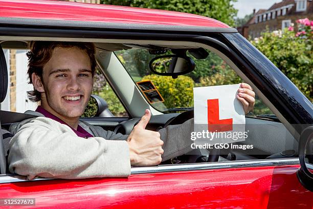 teen youth passes driving test - boy with car stock pictures, royalty-free photos & images