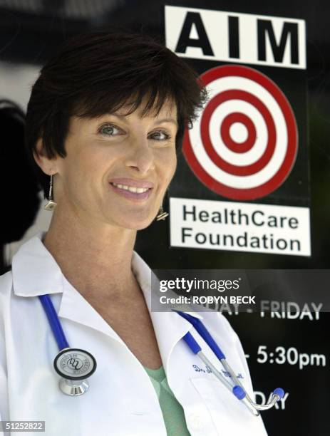 Dr. Sharon Mitchell poses for a photo at the entrance to the Adult Industry Medical Health Care Foundation clinic, 19 August 2004 in Sherman Oaks,...