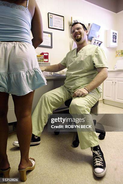 Lab technician Scott Phillips answering questions for an adult film actress concerned about how to avoid catching sexually transmitted diseases...