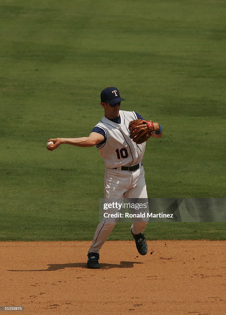 Derrick Devil Rays Michael Young of the Texas Rangers throws the ball to second base ...