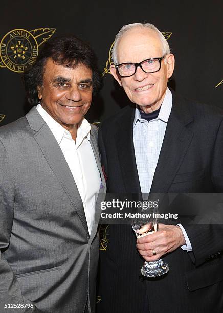 Singer Johnny Mathis and lyricist Alan Bergman, winner of the special award of merit, pose backstage at the 53rd Annual ICG Publicists Award at The...