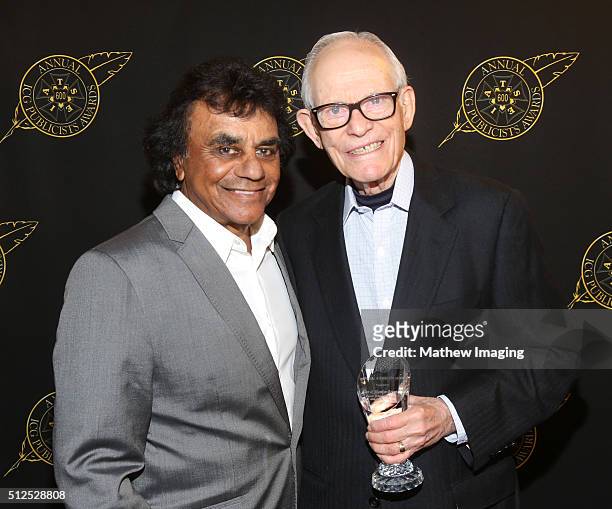 Singer Johnny Mathis and lyricist Alan Bergman, winner of the special award of merit, pose backstage at the 53rd Annual ICG Publicists Award at The...