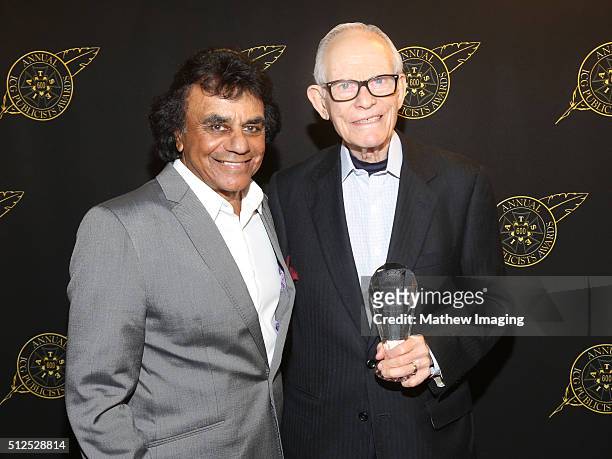 Singer Johnny Mathis and lyricist Alan Bergman, winner of the special award of merit, pose backstage at the 53rd Annual ICG Publicists Award at The...