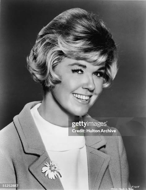 Portrait of American movie and television star, singer, and a friend to all the animals Doris Day as she wears a flower brooch, circa 1966.