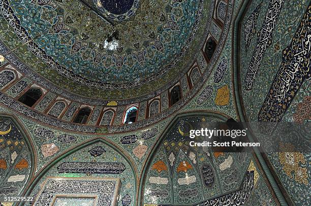 The roof gleams in tiles as Iranians vote in key elections for Parliament and the Assembly of Experts in the Hosseiniyeh Ershad mosque in Tehran,...
