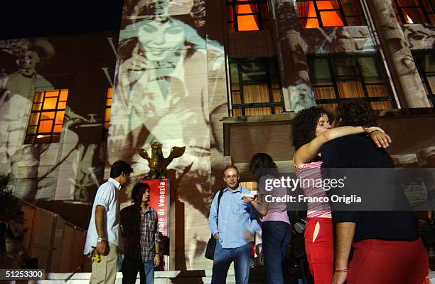 Couple kisses near the Casino during the opening ceremony of the 61st Venice Film Festiva on September 1, 2004 in Venice, Italy.