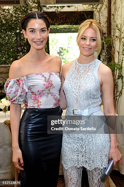 Model Lily Aldridge and actress Elizabeth Banks attend the Vanity Fair and Stuart Weitzman Luncheon to celebrate Elizabeth Banks at A.O.C on February...