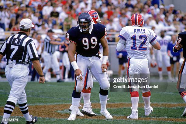 Defensive tackle Dan Hampton of the Chicago Bears argues a call with a referee after a play during the game against the Buffalo Bills at Soldier...