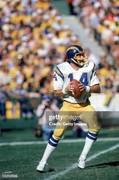 Quarterbck Dan Fouts of the San Diego Chargers looks to pass during a playoff game against the Miami Dolphins at Joe Robbie Stadium in Miami,...