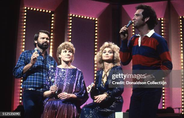 Singers Glen Campbell, Anne Murray, Barbara Mandrell and Larry Gatlin perform onstage in circa 1978.