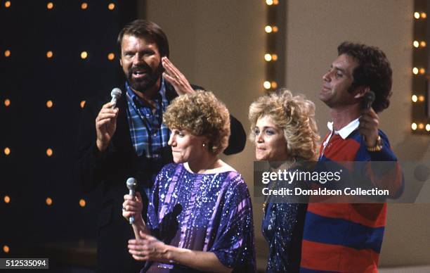 Singers Glen Campbell, Anne Murray, Barbara Mandrell and Larry Gatlin perform onstage in circa 1978.