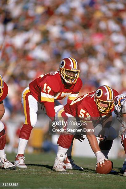Quarterback Doug Williams of the Washington Redskins calls a play at the line of Scrimmage against the Arizona Cardinals during a game at Sun Devil...