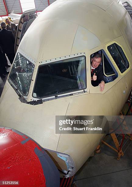German President Horst Koehler sits in the pilot?s seat of an Airbus A319 during his visit to the Airbus factory, September 1, 2004 in Hamburg,...