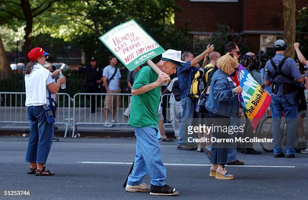 Seventy-year-old Henry Marahan, of New York City, carries a sign from the American Federation of State, County and Municipal Employees during a...