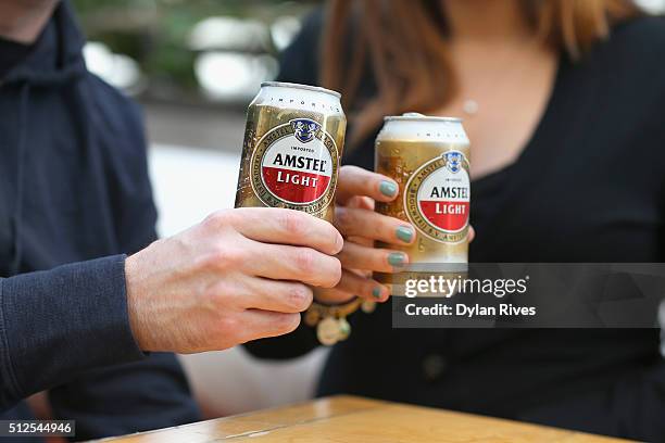 Guests enjoy Amstel Light Lager Beer at the Grilled Cheese Happy Hour Hosted By Laura Werlin And Ms. Cheezious during 2016 Food Network & Cooking...