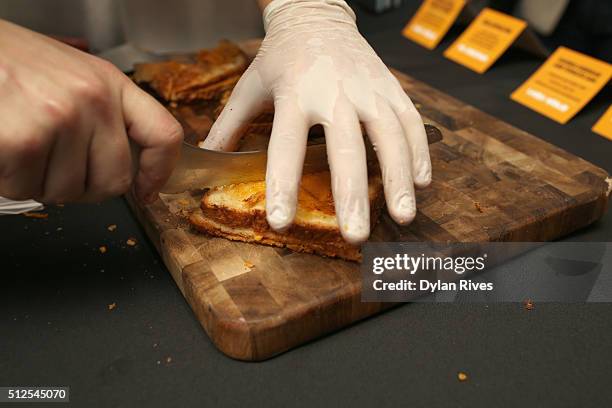 Chef prepares food at the Grilled Cheese Happy Hour Hosted By Laura Werlin And Ms. Cheezious during 2016 Food Network & Cooking Channel South Beach...