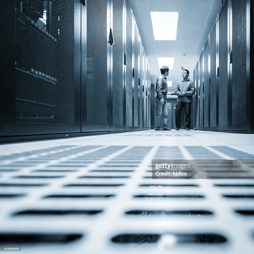 Administrators working on a server room