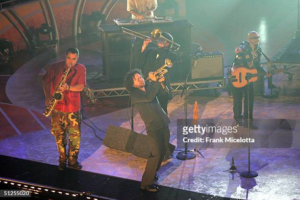 Musical Group Ozomatli with George Lopez perform on stage at the "5th Annual Latin Grammy Awards" held at the Shrine Auditorium on September 1, 2004...