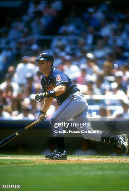 Jim Thome of the Cleveland Indians swings and watches the flight of his ball against the New York Yankees during a Major League Baseball game circa...