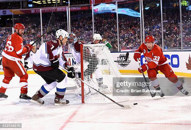 Greg de Vries of the Colorado Avalanche Alumni and Kris Draper of the Detroit Red Wings Alumni vie for the puck during the 2016 Coors Light Stadium...