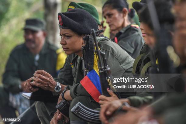 By Hector Velasco Revolutionary Armed Forces of Colombia guerrillas listen during a "class" on the peace process between the Colombian government and...