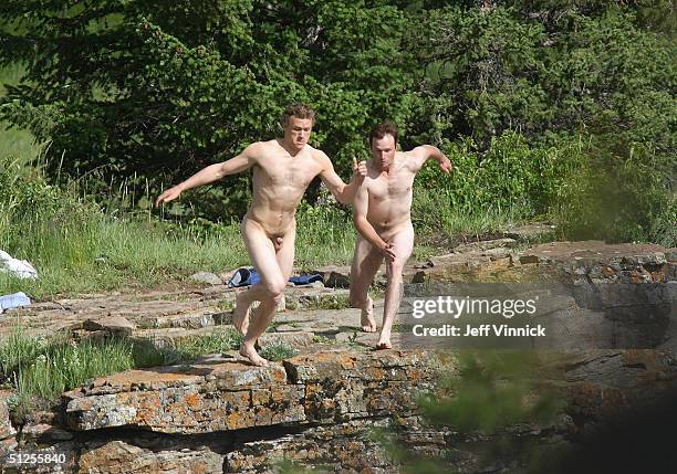 Actors Heath Ledger and a stunt double for Jake Gyllenhaal jump off a cliff 30 feet into the Bow River during filming of Brokeback Mountain July 5,...