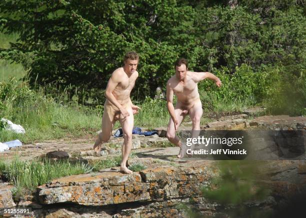 Actors Heath Ledger and a stunt double for Jake Gyllenhaal jump off a cliff 30 feet into the Bow River during filming of Brokeback Mountain July 5,...