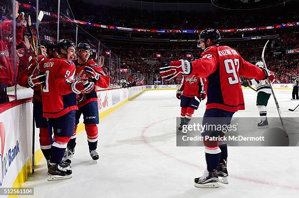 Dmitry Orlov of the Washington Capitals celebrates his third period goal with his teammates during their game against the Minnesota Wild at Verizon...