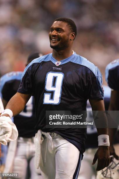 Steve McNair of the Tennessee Titans smiles as he walks during the preseason NFL game against the Dallas Cowboys on August 30, 2004 at Texas Stadium...