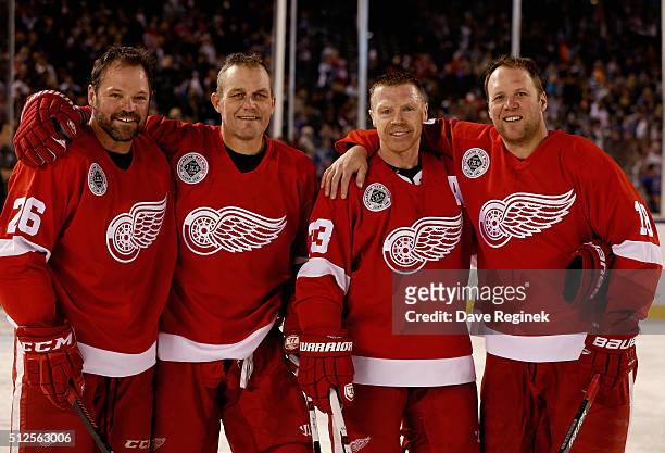 Joe Kocur 326, Darren McCarty, Kris Draper and Kirk Maltby of the Detroit Red Wings Alumni pose for a group photo after their 5-2 loss to the...