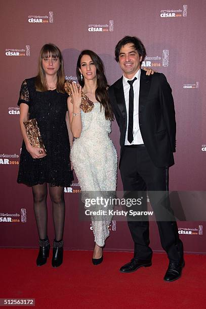 Alice Winocour, Deniz Gamze Erguven and Charles Gillibert pose with their award for Best Script and Best Feature Film for the movie 'Mustang' during...