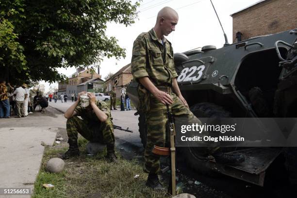 Russian soldiers stand guard near a school taken over by terrorist September 2, 2004 in the town of Beslan, Russia. Russian authorities ruled out for...