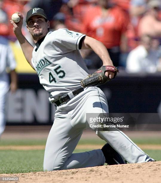 Carl Pavano of the Florida Marlins throws out Gerald Williams of the New York Mets in the third inning on September 2, 2004 at Shea Stadium in...
