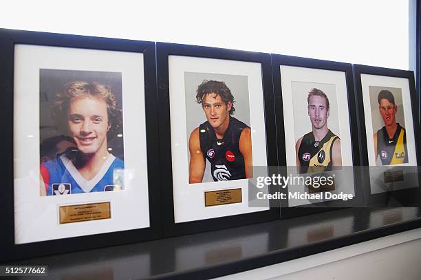 Portraits of former AFL players Michael McKenna, Brendan Fevola, Shane Tuck and Chris Newman are seen in the Beaconsfield club rooms as a result of...