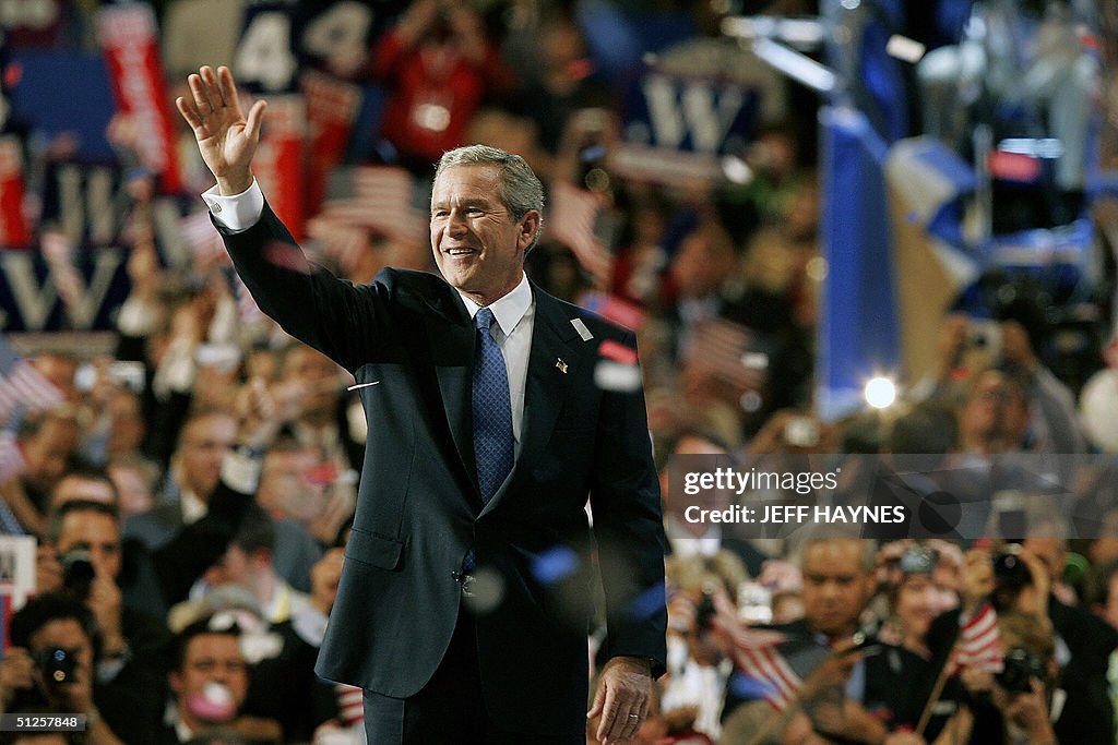 US President George W. Bush waves after