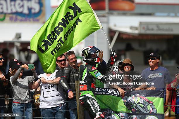 Jonathan Rea of Great Britain and rider of the Kawasaki Racing Team Kawasaki celebrates with fans after winning race one of round one of the 2016...