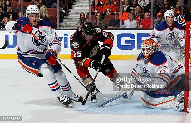 Mike Santorelli of the Anaheim Ducks skates against Leon Draisaitl and Cam Talbot of the Edmonton Oilers on February 26, 2016 at Honda Center in...
