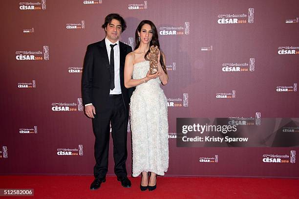 Charles Gillibert and Deniz Gamze Erguven pose with their award for Best Feature Film for the movie 'Mustang' during The Cesar Film Awards 2016 at...