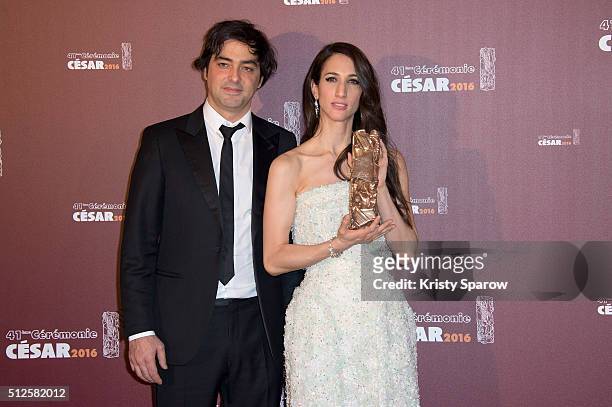 Charles Gillibert and Deniz Gamze Erguven pose with their award for Best Feature Film for the movie 'Mustang' during The Cesar Film Awards 2016 at...