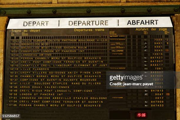 Panel of arrivals and departures of trains from Gare du Nord in Paris in France