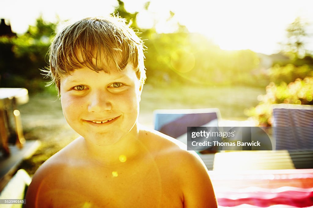 Portrait of smiling young boy on a summer evening