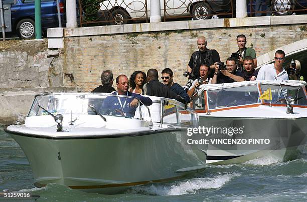 Actor Tom Cruise arrives with director Michael Mann, actor Jamie Foxx, and Jada Pinkett Smitt on motorboat followed by photographers at Venice Lido...