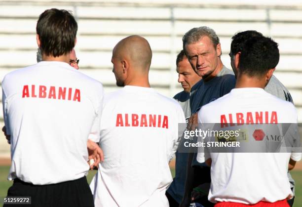 Albanian national team coach, German Hans-Peter Briegel looks at photographers during a training session, in Durres, on the eve of their match...